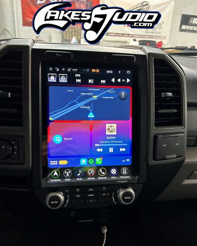 Ford F-250 A large car dashboard touchscreen displaying a navigation map and media controls.