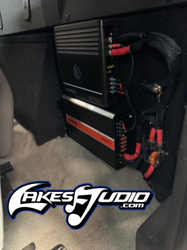 2007 Silverado Sound System Car audio equipment mounted on a panel, featuring amplifiers and wiring.