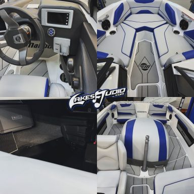 Malibu Boat Luxury boat interior featuring a sleek design with gray and blue accents.